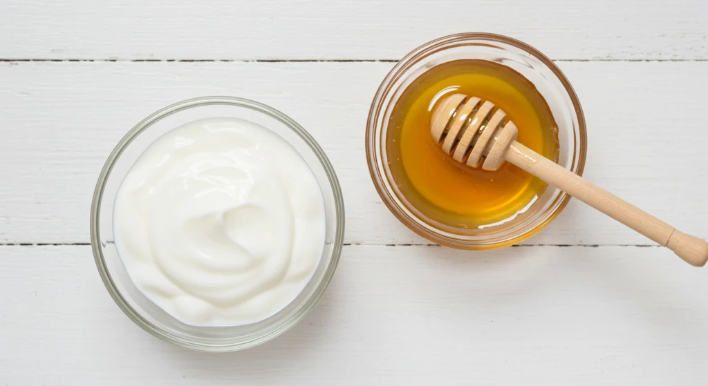 honey and yougurt on bowl
